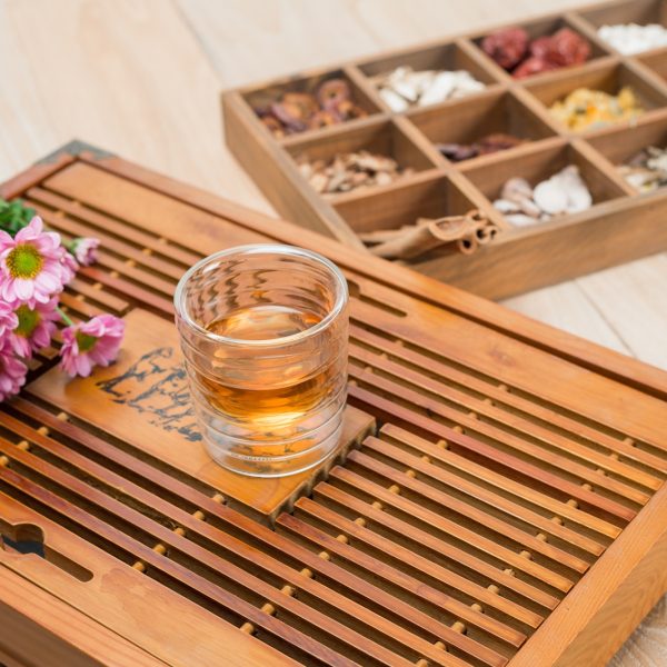 Chinese Herbal Medicine in box on table.